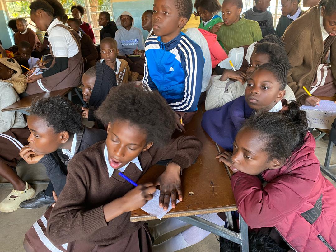 Pupils writing during an environmental class