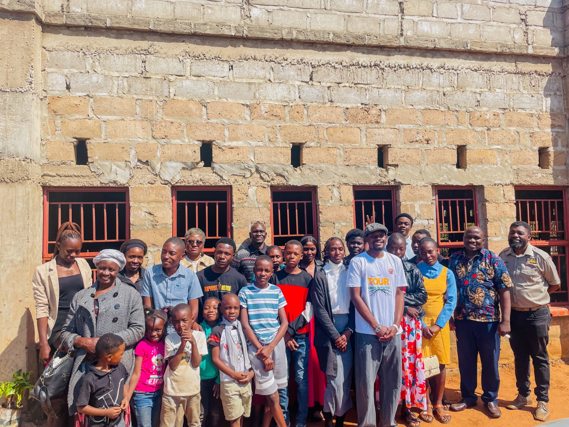 Tour de Force Green Initiative team with a community in Zambia