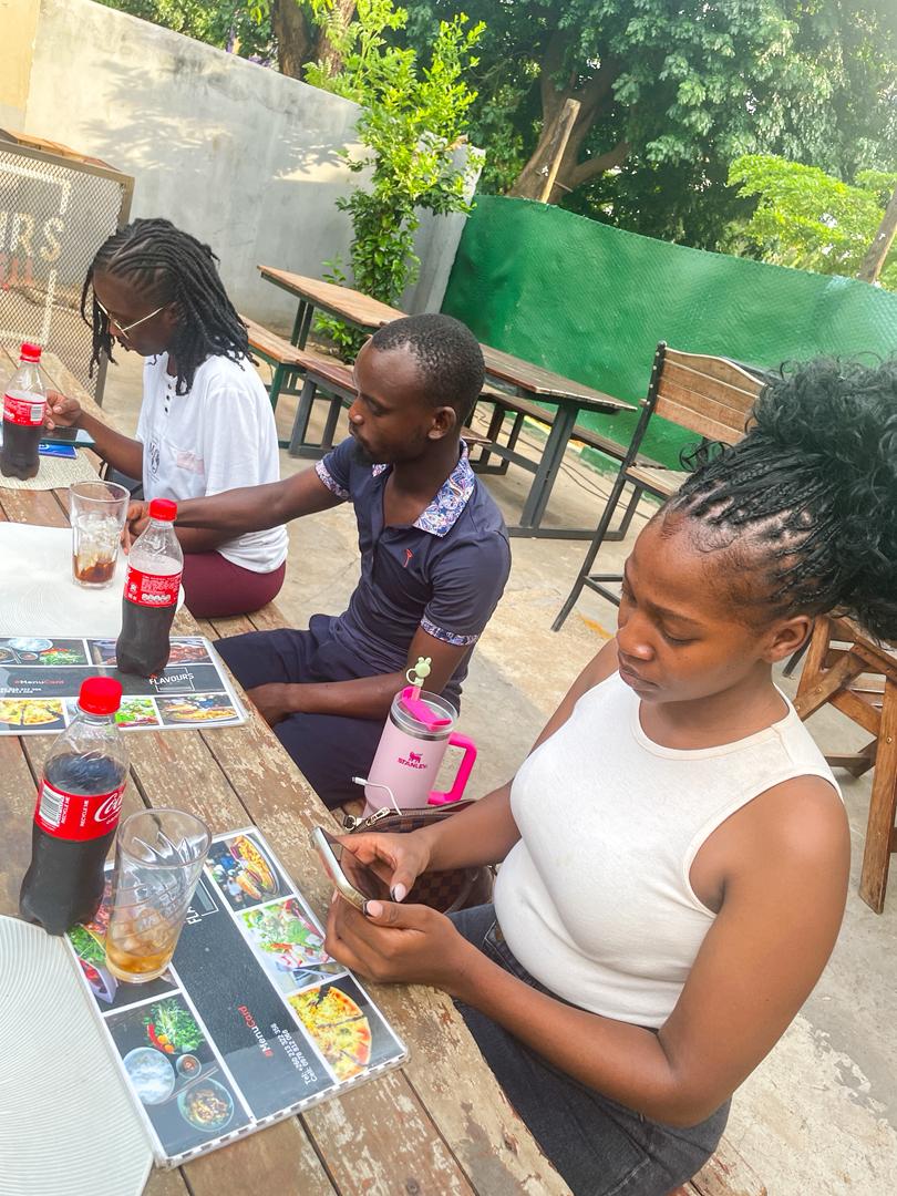 Volunteers planning outdoors at a table